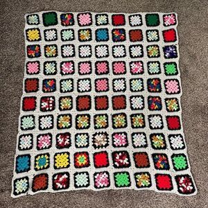Colorful black/cream granny square blanket